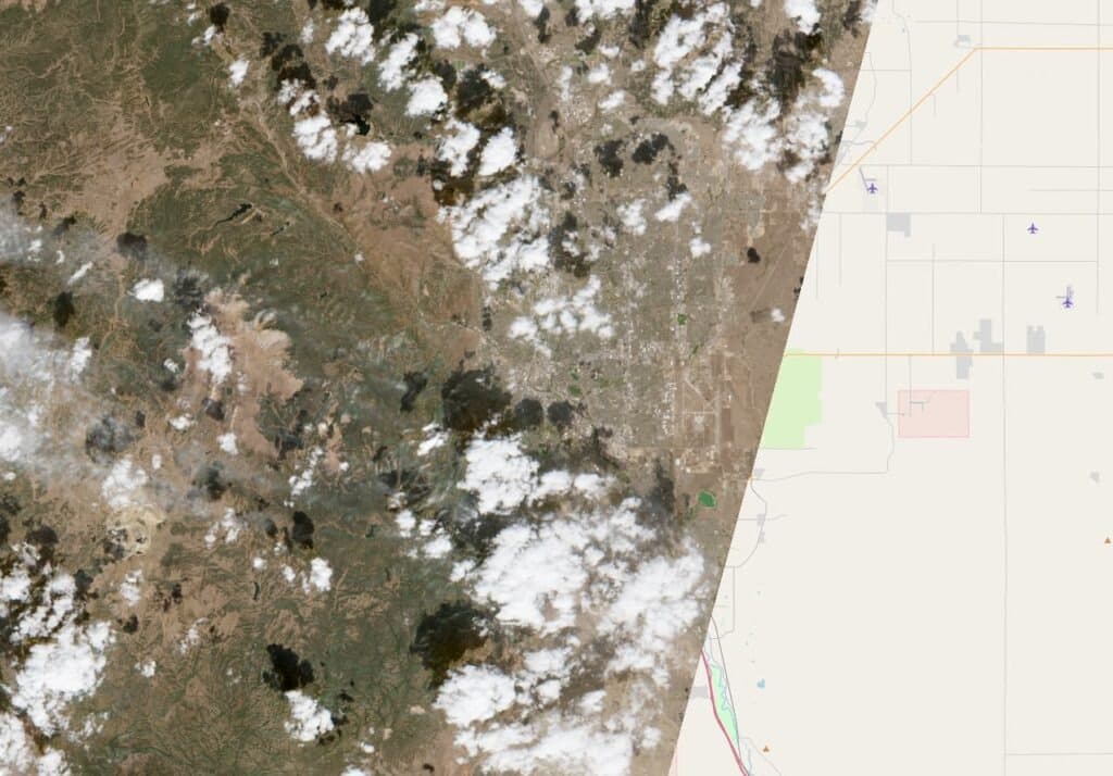 A satellite image of Colorado Springs, Colorado. It covers only part of the map, and clouds cover parts of the landscape.